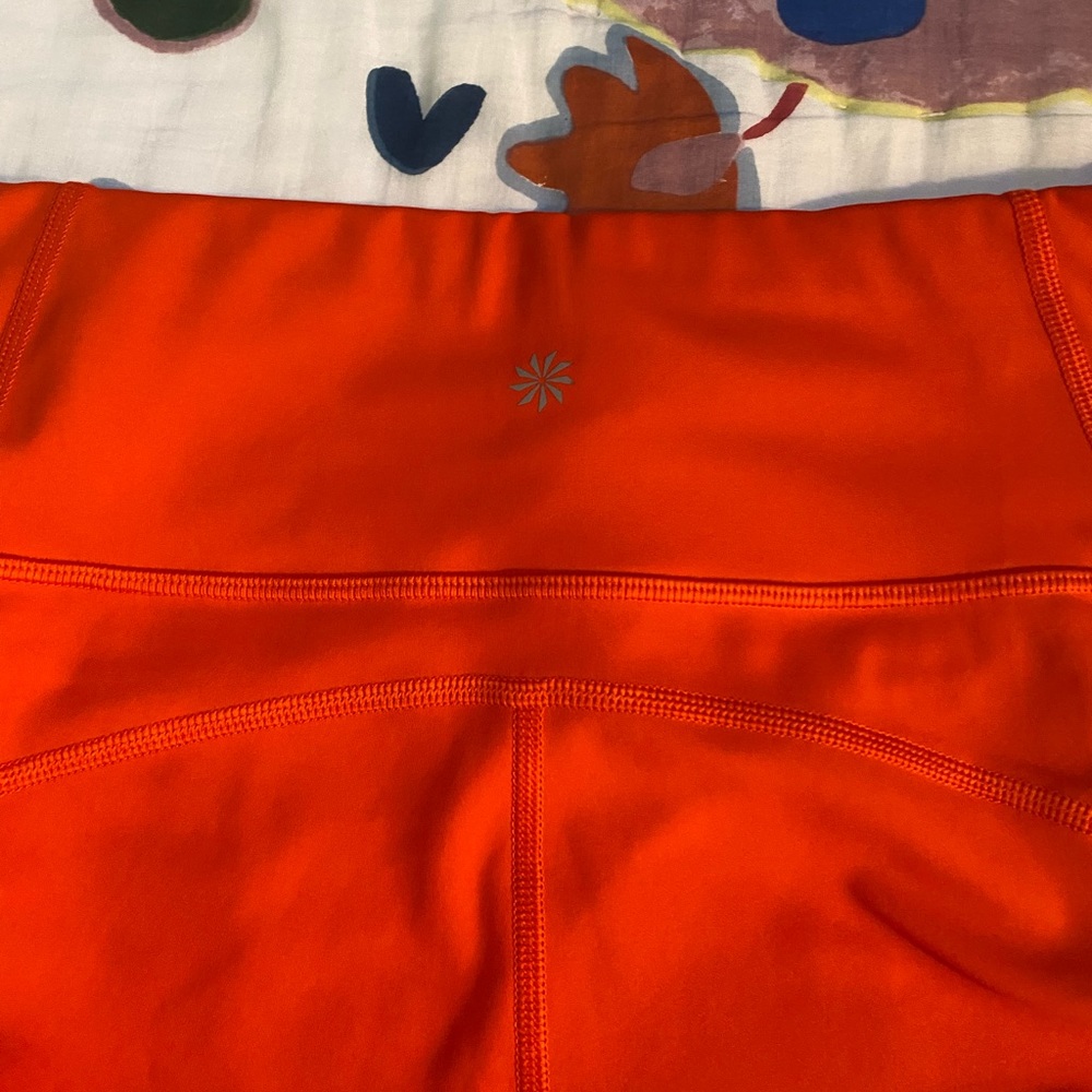 Athleta Orange leggings. Inside pocket for keys or money. Side zipper pockets. - Picture 5 of 5